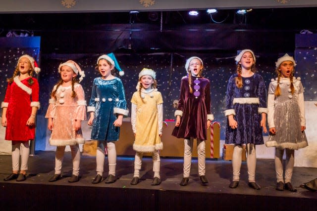 The 2017 Knoxville Children’s Theatre production of “Elf: The Musical Jr.” featured Eva Rogers, in red, and Evie Braude, in blue, as elves. Rogers is stage manager for the current production, and her younger sister Amy will play an elf. Braude, now a Webb High School senior, is the director. Nov. 2017