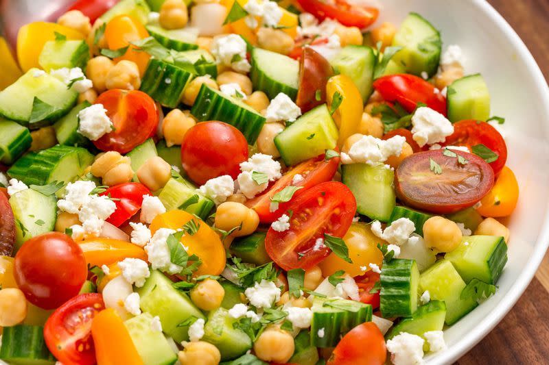 <p>This bright, satisfying salad comes together in 10 minutes tops.</p><p>Get the <a href="https://www.delish.com/uk/cooking/recipes/a33008226/tomato-cucumber-feta-salad-recipe/" rel="nofollow noopener" target="_blank" data-ylk="slk:Tomato Cucumber Feta Salad;elm:context_link;itc:0;sec:content-canvas" class="link ">Tomato Cucumber Feta Salad</a> recipe.</p>