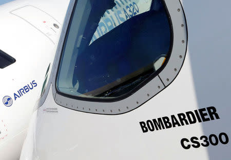 An Airbus A320neo aircraft and a Bombardier CSeries aircraft are pictured during a news conference to announce a partnership between Airbus and Bombardier on the C Series aircraft programme, in Colomiers near Toulouse, France, October 17, 2017. REUTERS/Regis Duvignau