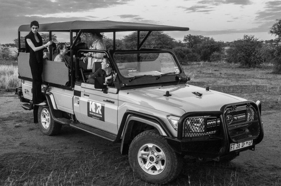 <p>In the presence of lions, Cara demonstrates her strength and humility. Source: David Yarrow/TAG </p>