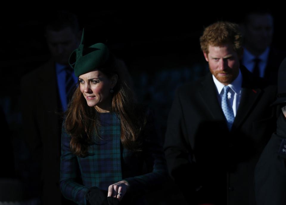 Britain's Catherine, the Duchess of Cambridge, and Prince Harry leave a Christmas Day morning service at the church on the Sandringham Estate in Norfolk, eastern England, December 25, 2013. REUTERS/Andrew Winning (BRITAIN - Tags: ROYALS RELIGION)