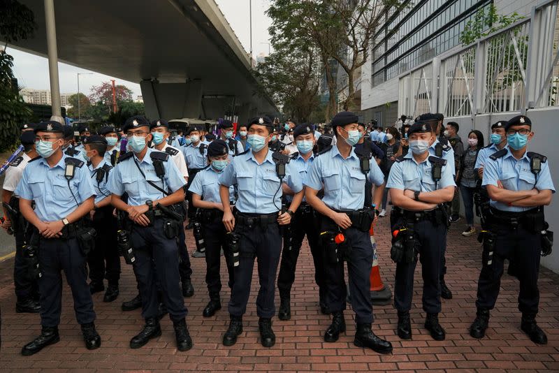 Police officers outside West Kowloon Magistrates' Courts in Hong Kong