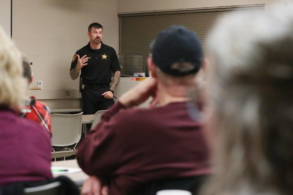 Summit county sheriff deputy Nat Buckohr talks about how to act during a traffic stop and what is expected from a motorist during concealed carry workshop at the Summit County Sheriff's Office Training Center in Green.