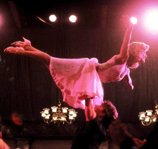 Patrick Swayze holding Jennifer Grey in a dance lift