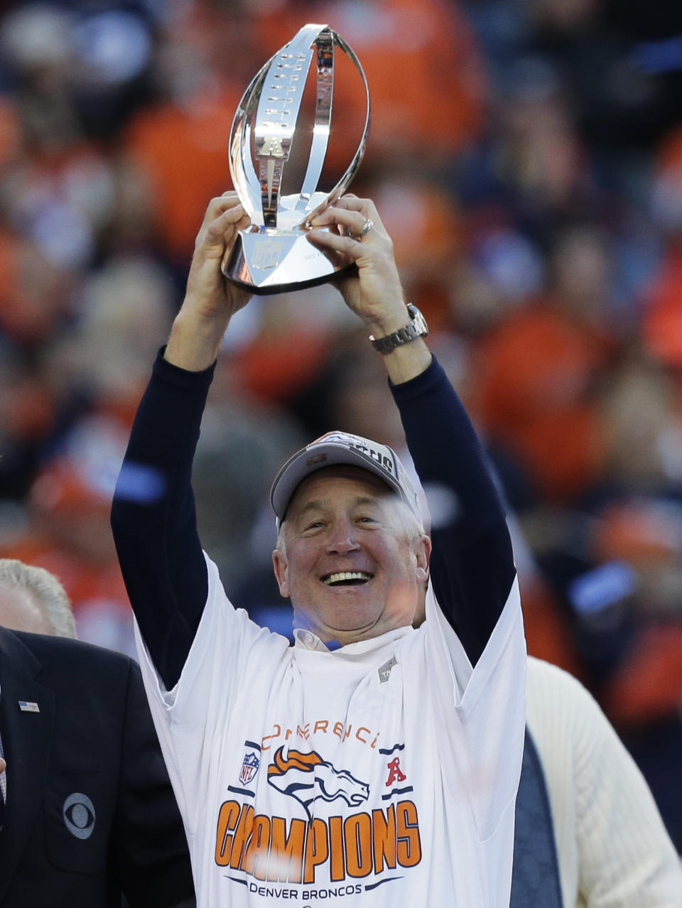 Denver Broncos head coach John Fox celebrates with the trophy after the AFC Championship NFL playoff football game against the New England Patriots in Denver, Sunday, Jan. 19, 2014. The Broncos defeated the Patriots 26-16 to advance to the Super Bowl. (AP Photo/Julie Jacobson)