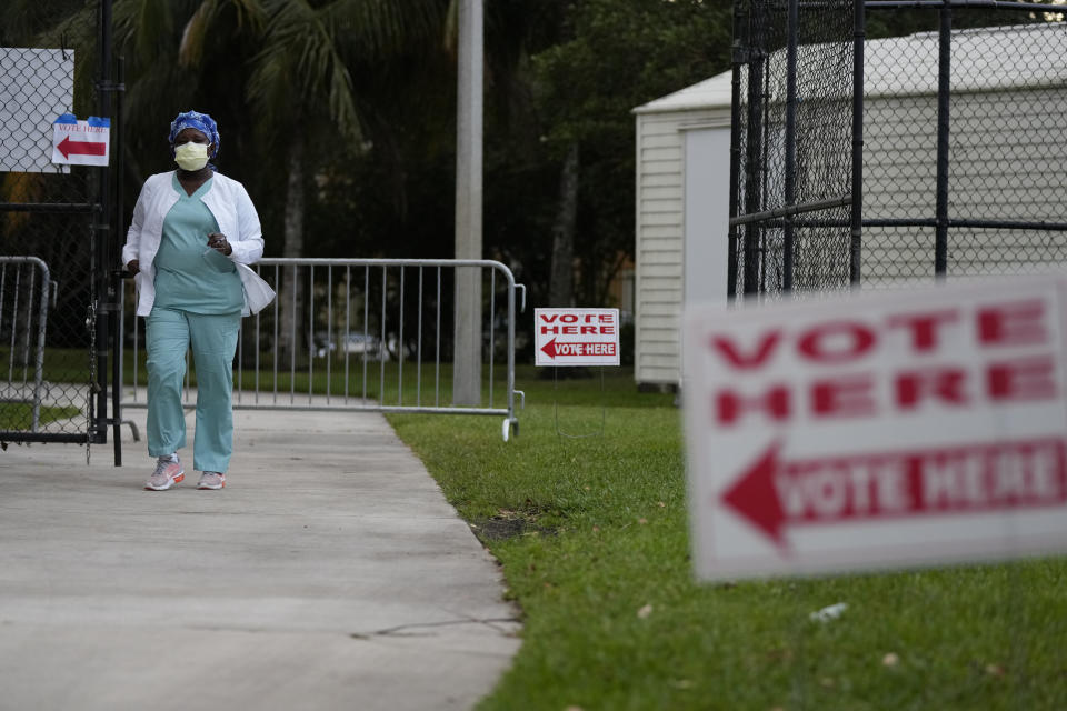 A voter leaves after casting her ballot in a special election for Florida's 20th Congressional District seat, at a polling place at the Ansin Sports Complex, Tuesday, Jan. 11, 2022, in Miramar, Fla. Democratic Sheila Cherfilus-McCormick, a health care company CEO, faces Republican Jason Mariner in the special election to fill the U.S. congressional seat left vacant after Democratic U.S. Rep. Alcee Hastings died last April of pancreatic cancer. (AP Photo/Rebecca Blackwell)