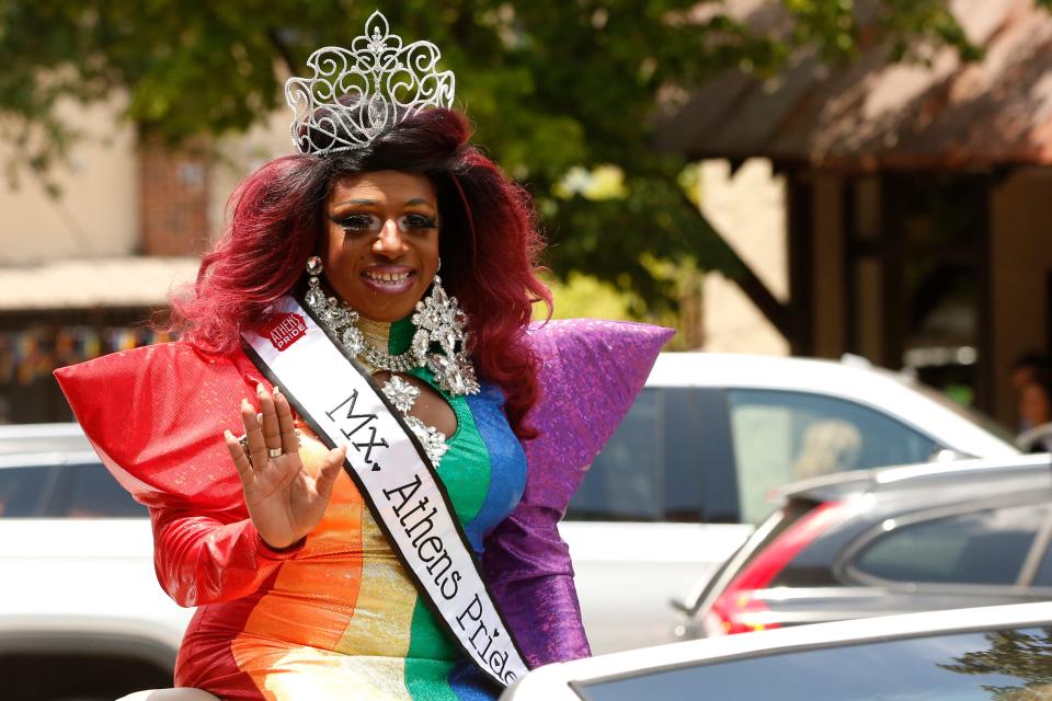 Mx. Athens Pride Diamond waves to the crowd during the inaugural Athens Pride Parade through downtown Athens, Ga., on Sunday, June 12, 2022. Athens Pride was organized by the Athens Pride and Queer Collective.