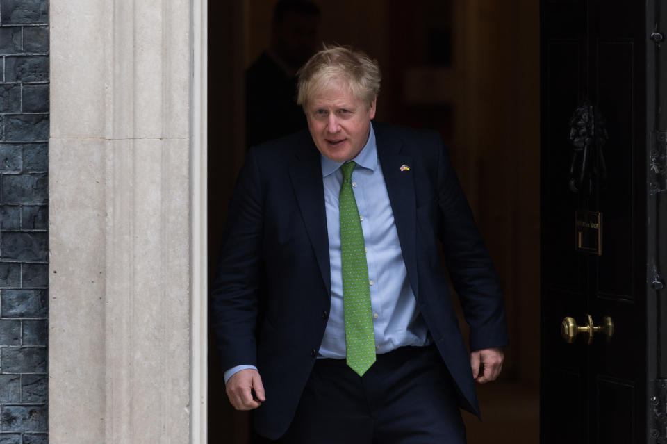 LONDON, UNITED KINGDOM - MARCH 15, 2022: British Prime Minister Boris Johnson steps out from 10 Downing Street to welcome  Prime Minister of Sweden, Magdalena Andersson (not pictured) ahead of their meeting on March 15, 2022 in London, England. Boris Johnson today hosted a summit of the Joint Expeditionary Force with leaders of Nordic and Baltic countries to discuss increasing defensive military support to Ukraine following Russian invasion, long-term energy security and cybersecurity. (Photo credit should read Wiktor Szymanowicz/Future Publishing via Getty Images)