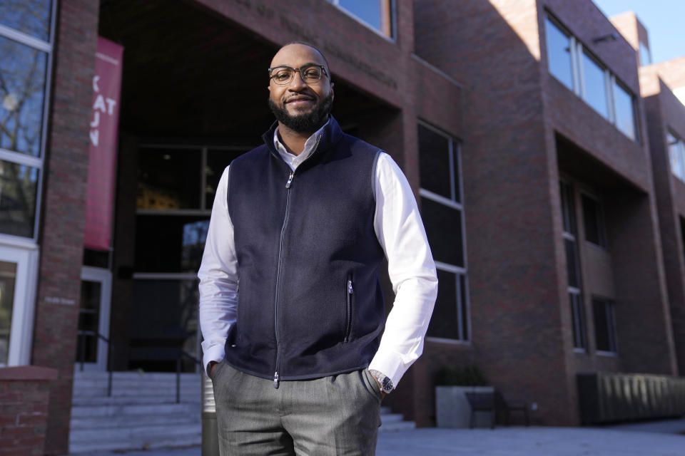 Quentin Fulks, who managed Sen. Raphael Warnock's re-election campaign in 2022, stands for a portrait outside the John F. Kennedy School of Government at Harvard University, Thursday, Feb. 2, 2023, in Cambridge, Mass. Growing up Black in a majority white county where Donald Trump won 79% of the vote helped Fulks understand what Democrats had to do to win in a historically conservative state. (AP Photo/Charles Krupa)