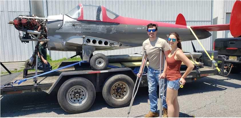 Ian Azeredo with his wife, Linda, and the 1946 Ercoupe plane he is restoring.