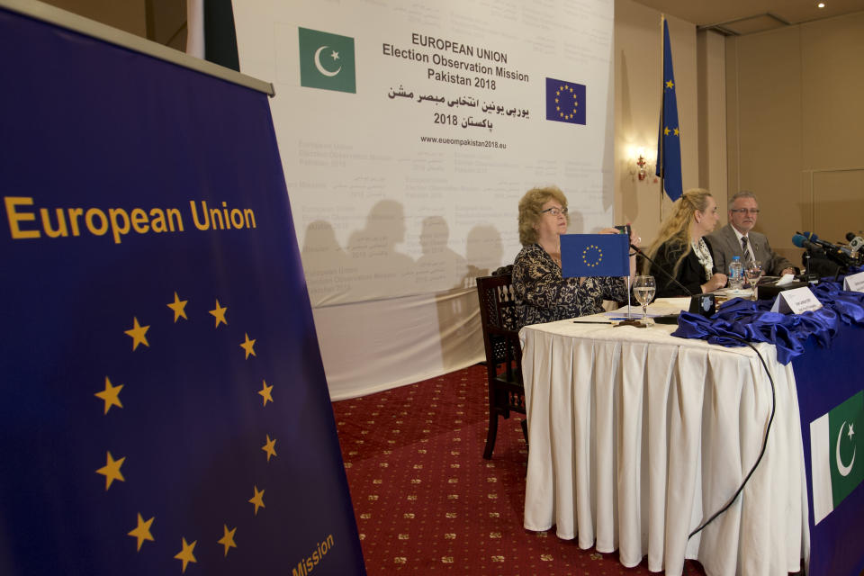 Michael Gahler, right, the European Union's monitoring team chief addresses a news conference in Islamabad, Pakistan, Friday, July 27, 2018. The European Union's monitoring team gave a passing grade to election day polling in Pakistan. But it gave a failing grade to the pre-polling campaigning marred by intimidation of the media and unfair targeting of the former ruling party, which it said overshadowed the successes. (AP Photo/B.K. Bangash)