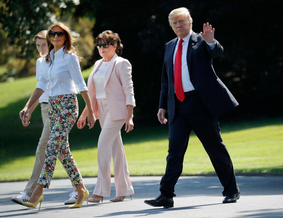 Melania Trump's mother, Amalija Knavs (center), seen here preparing to board Marine One for the helicopter flight to Andrews Air Force Base, became a U.S. citizen Thursday, along with her husband, Viktor.