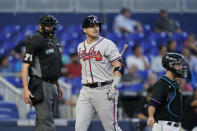 Atlanta Braves' Austin Riley reacts after striking out during the first inning of a baseball game against the Miami Marlins, Tuesday, Oct. 4, 2022, in Miami. (AP Photo/Wilfredo Lee)