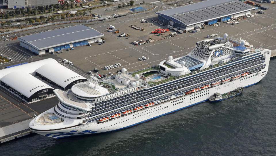 The cruise ship Diamond Princess is docked at Yokohama Port, near Tokyo, Friday, Feb. 7, 2020. Japan on Friday reported 41 new cases of a virus on the cruise ship that's been quarantined. About 3,700 people have been confined aboard the ship. (Sadayuki Goto/Kyodo News via AP)