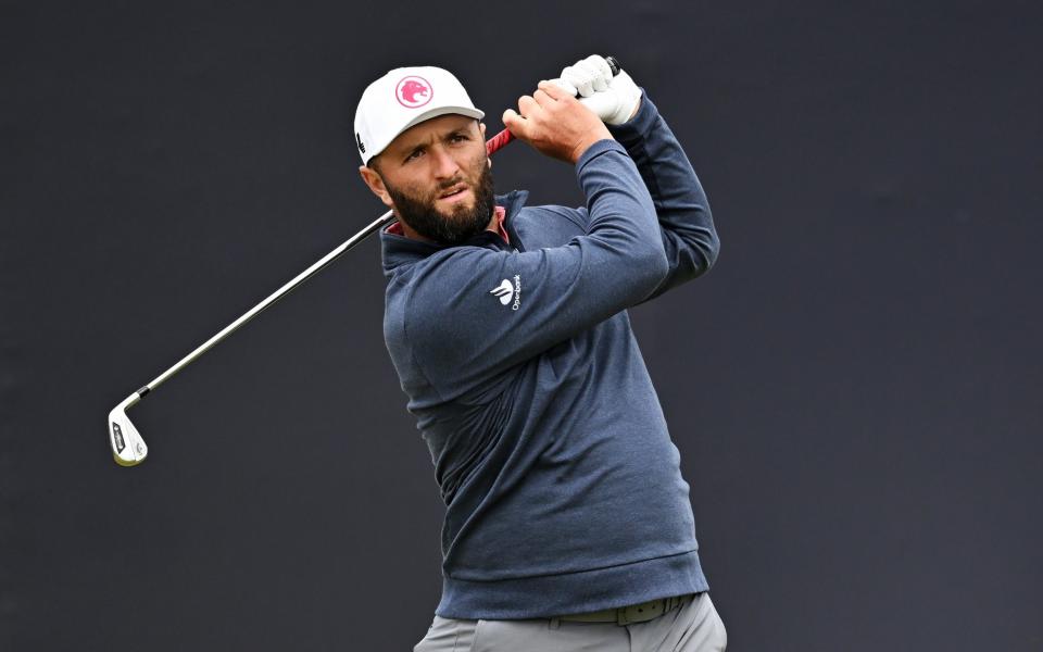 Rahm hits his shot from the first tee on day four of the Open