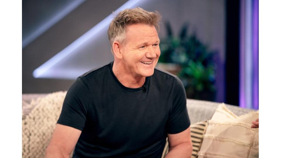 Gordon Ramsay in a T-shirt sat on sofa