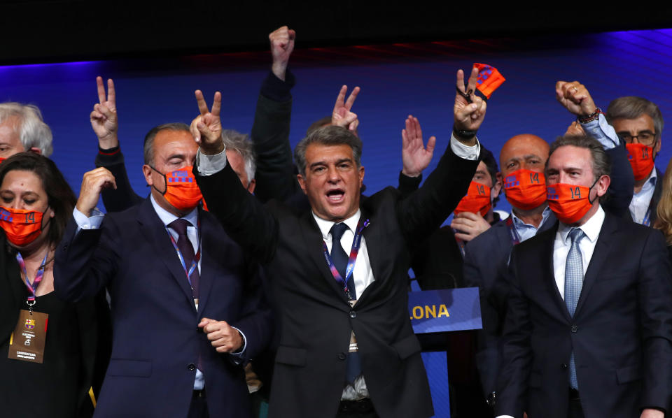 Joan Laporta celebrates his victory after elections at the Camp Nou stadium in Barcelona, Spain, Sunday, March 7, 2021. Joan Laporta has been elected Barcelona's president on Sunday, inheriting a club mired in debt and facing daunting problems that include the possible departure of Messi when his contract ends at the end of the season. (AP Photo/Joan Monfort)