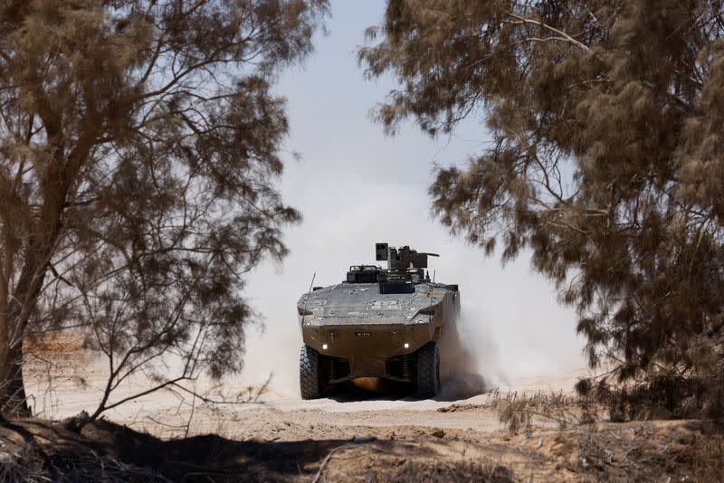 An Israeli military vehicle manoeuvres near the Israel-Gaza border