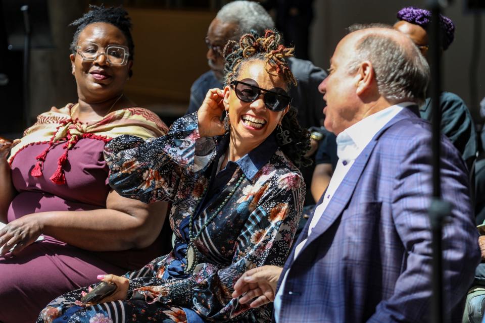 Jessica Care Moore chats with Detroit Mayor Mike Duggan as she is announced as the new poet laureate of Detroit at Newlab in Detroit on Tuesday, April 30, 2024.