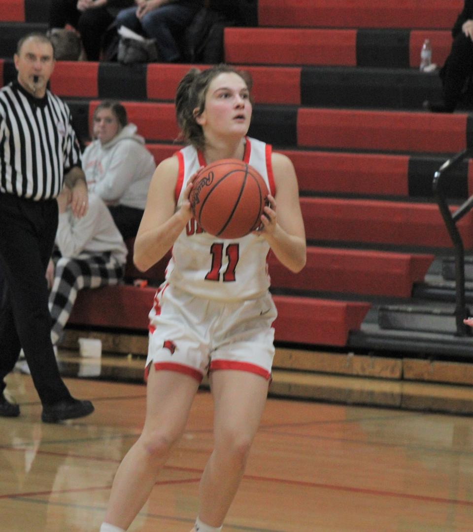 Sophomore guard Kailyn George (11) led the Onaway Cardinals with a game-high 22 points in Friday's home victory over Forest Area.