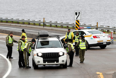 Canadian police check a car next to the red zone security perimeter around the Manoir Richelieu ahead of G7 Summit in La Malbaie, Canada June 5, 2018. REUTERS/Yves Herman