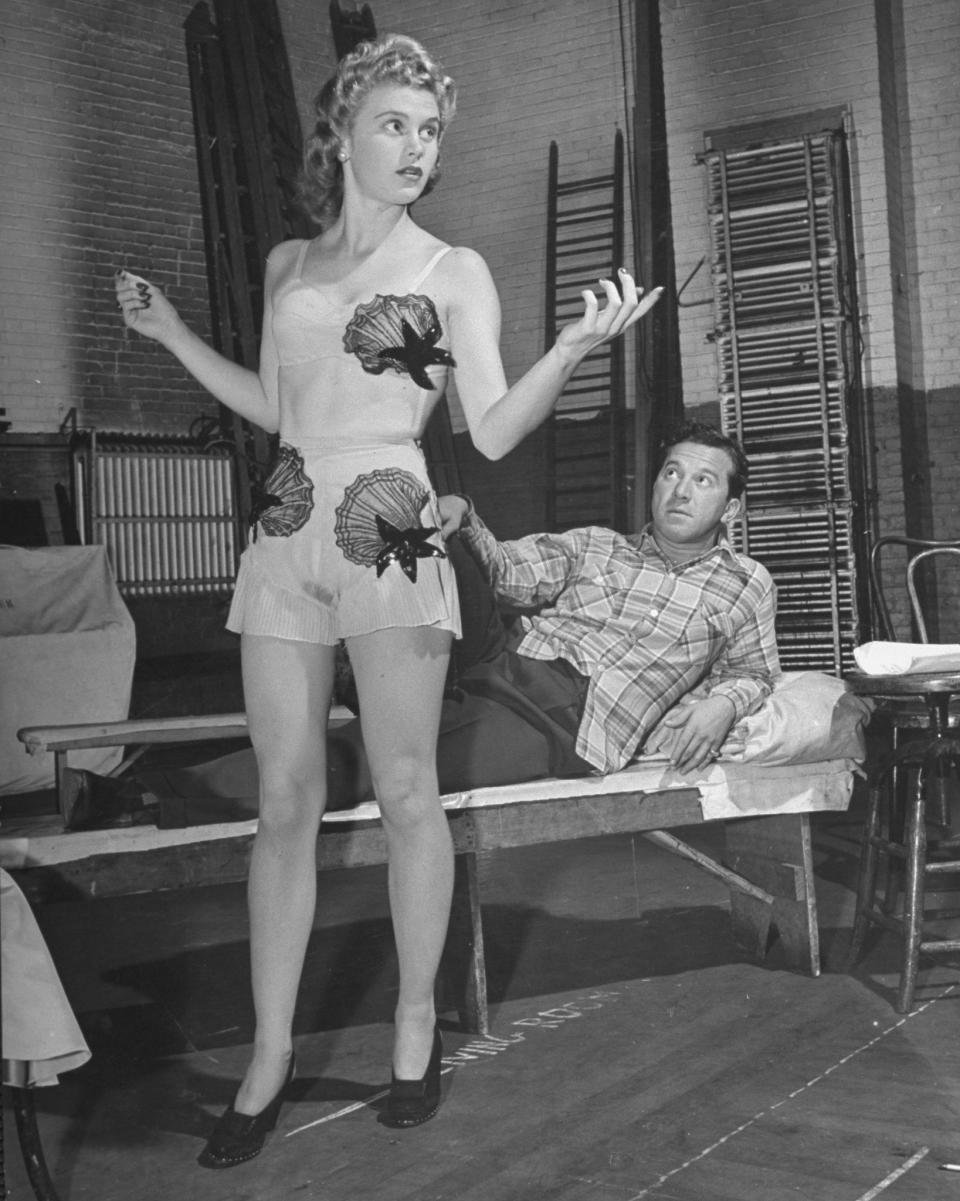 <span><span>Actress Joan Caulfield and actor George Abbott performing in a scene from the play Kiss & Tell, 1942</span><br><span>George Karger / Getty</span></span>