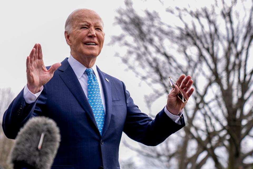 President Joe Biden speaks to members of the media before boarding Marine One on the South Lawn of the White House in Washington, Tuesday, Jan. 30, 2024.