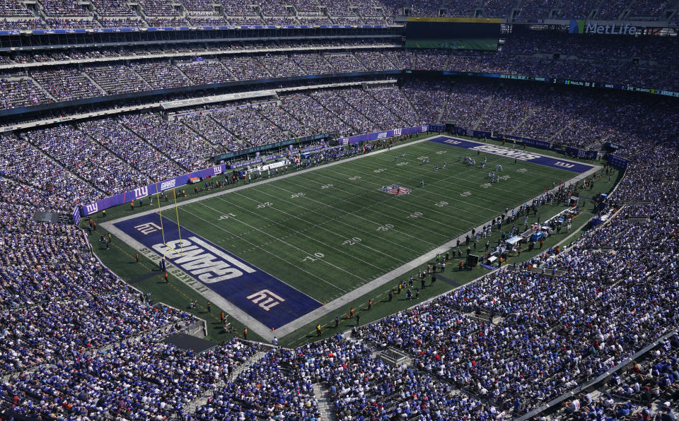 FILE - The New York Giants play against the Carolina Panthers during the first half an NFL football game Sept. 18, 2022, in East Rutherford, N.J. The NFL Players Association is calling on six venues, including East Rutherford, to change their current playing surfaces, saying the turf in those stadiums results in “statistically higher in-game injury rates” involving non-contact and lower-extremity injuries. (AP Photo/Seth Wenig, File)