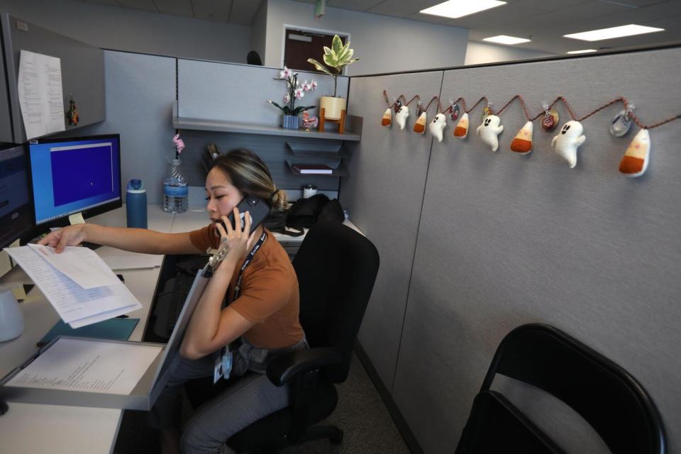 Maggie Tran searches databases on her computer.