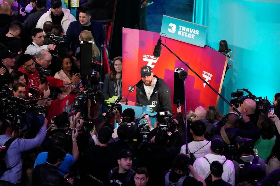 Chiefs tight end Travis Kelce answers questions from the assembled media at last year's Super Bowl Opening Night in Phoenix.