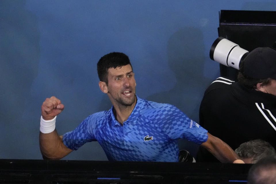 Novak Djokovic of Serbia celebrates after defeating Stefanos Tsitsipas of Greece in the men's singles final at the Australian Open tennis championships in Melbourne, Australia, Sunday, Jan. 29, 2023. (AP Photo/Ng Han Guan)