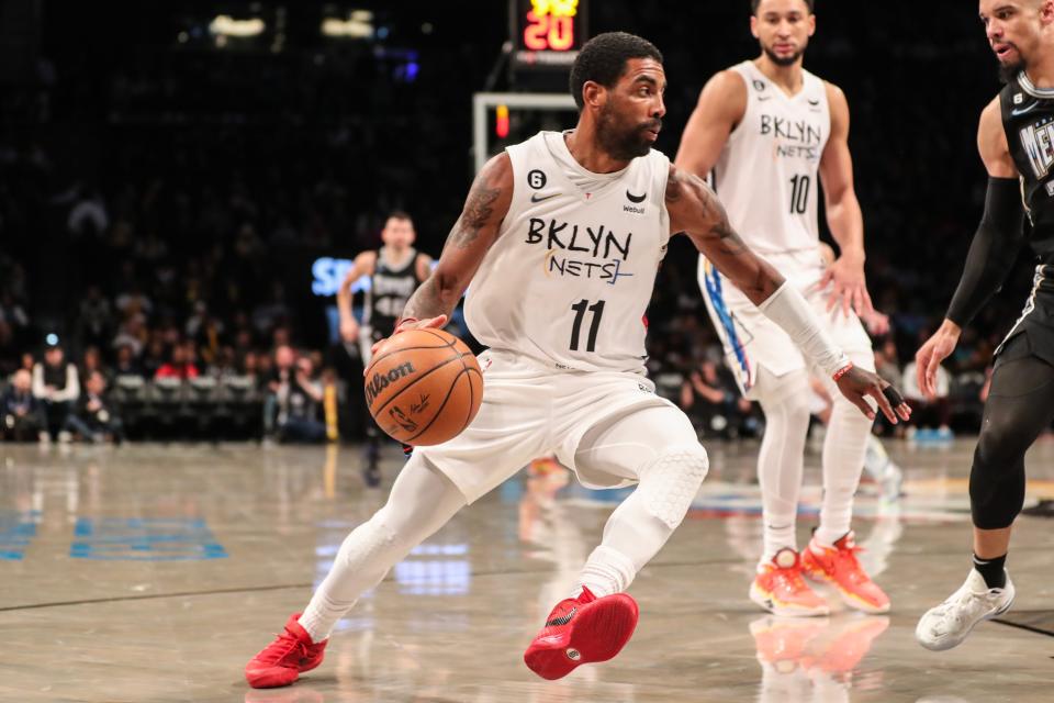 Kyrie Irving (11) drives to the basket against the Memphis Grizzlies at Barclays Center.