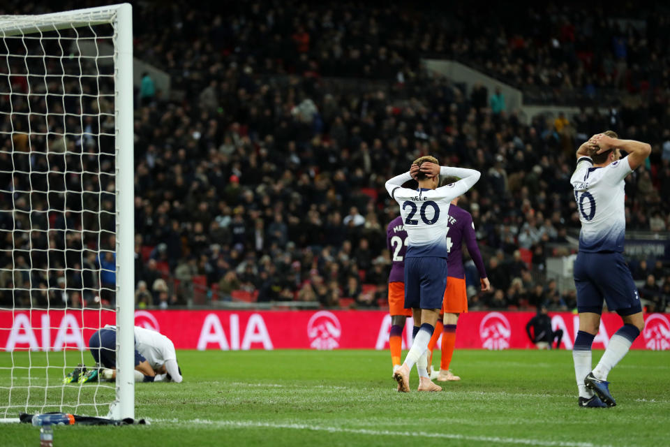 Head in hands moment: Alli and Kane react after Lamela missed a late chance