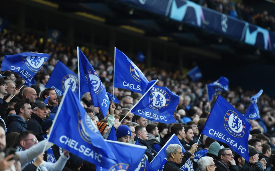 Fans of Chelsea wave flags prior to the UEFA Champions League quarterfinal second leg - Getty Images/Harriet Lander