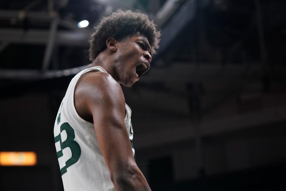 Miami guard Kameron McGusty celebrates after scoring during the second half of an NCAA college basketball game against Syracuse, Wednesday, Jan. 5, 2022, in Coral Gables, Fla. (AP Photo/Wilfredo Lee)