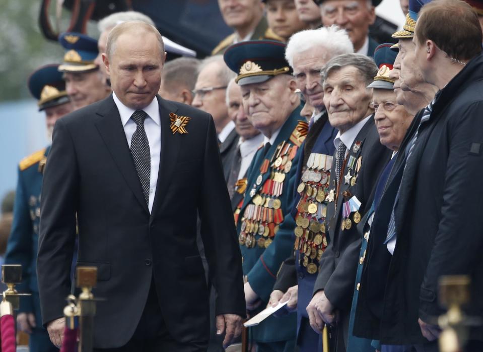 FILE In this file photo taken on Thursday, May 9, 2019, Russian President Vladimir Putin walks attending a military parade marking 74 years since the victory in WWII in Red Square in Moscow, Russia. Russian President Vladimir Putin has ordered the postponement of a Victory Day parade marking the 75th anniversary of the end of World War II, citing the ongoing public health threat from the coronavirus pandemic. Speaking in televised remarks on Thursday, April 16, 2020, Putin said the festivities would be held later this year. (AP Photo/Alexander Zemlianichenko, File)
