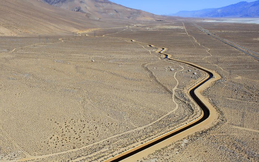 Aerial view of the Los Angeles Aqueduct as it flows south in its concrete-lined channel alongside Hwy 395 June 26, 2013 south of the Owens Valley town of Lone Pine. View is looking north into the Owens Valley.