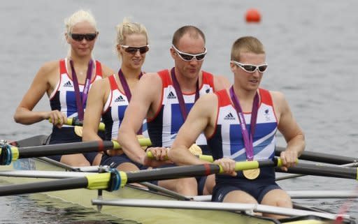 Britain's Pamela Relph, Naomi Riches, Davis Smith, James Roe and Lily van den Broecke row off with their gold medals after winning the LTA mixed coxed four in Eton Dorney