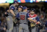 Mar 22, 2017; Los Angeles, CA, USA; USA pitcher David Robertson (30), infielder Eric Hosmer (35), outfielder Giancarlo Stanton (27), infielder Nolan Arenado (12) and catcher Jonathan Lucroy (25) celebrate the 8-0 championship victory against Puerto Rico during the 2017 World Baseball Classic at Dodger Stadium. Gary A. Vasquez-USA TODAY Sports