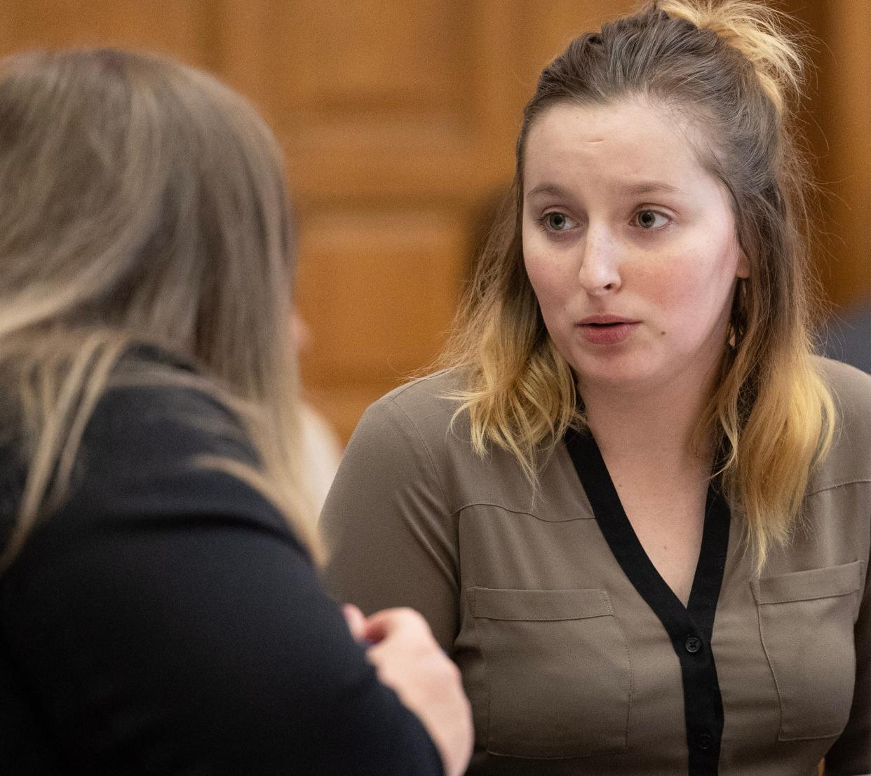 Marissa Smith, right, speaks with her public defender Katelyn Shoemaker in front of Stark County Common Pleas Judge Natalie Haupt.