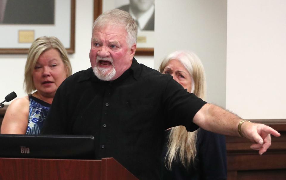 Larry Johnson, father of slain Rachael Johnson, gestures toward Daniel Rees as he gives his impact statement at Rees' plea and sentencing hearing Friday in Summit County Common Pleas Court.