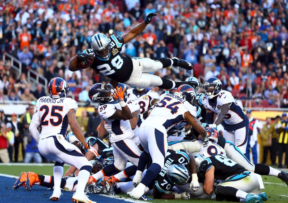 Feb 7, 2016; Santa Clara, CA, USA; Carolina Panthers running back Jonathan Stewart (28) dives over the pile of defenders for a touchdown against the Denver Broncos in the second quarter in Super Bowl 50 at Levi's Stadium. Mandatory Credit: Mark J. Rebilas-USA TODAY Sports TPX IMAGES OF THE DAY