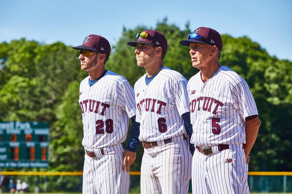 In 2021,  (left to right) coaches Tyle Hankins and Ken Jarrett join field manager Mike Roberts on the field at the start of the Cape League opener at Lowell Park against Wareham.