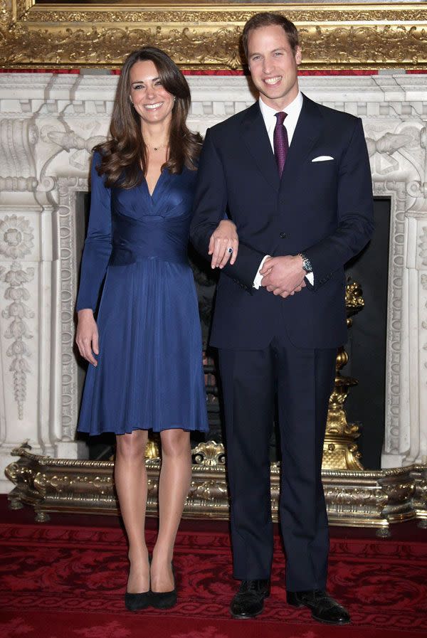 <p>In a navy Issa dress announcing her engagement at St. James Palace</p>