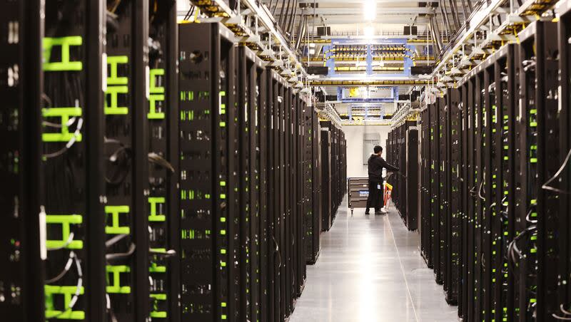 Work is performed on servers at Meta’s Eagle Mountain Data Center in Eagle Mountain on Friday, Sept. 30, 2022.