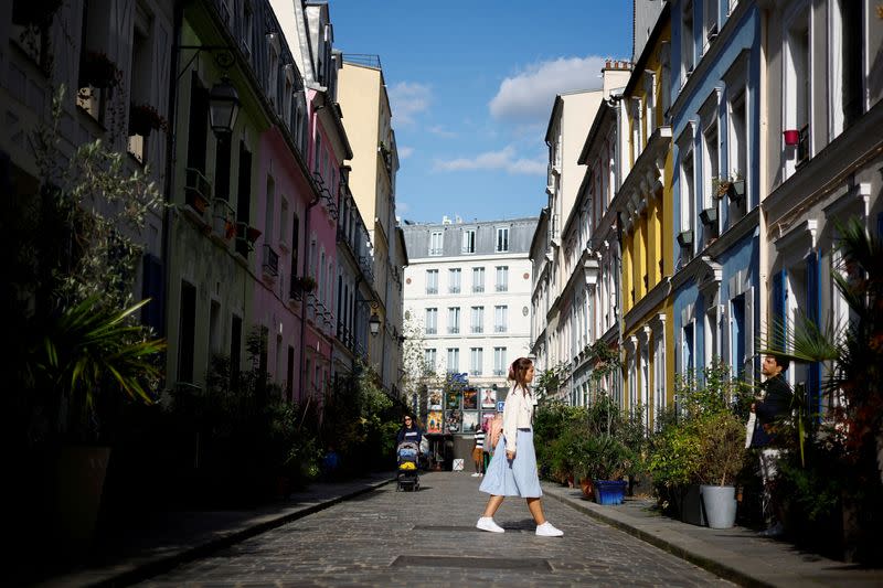 FILE PHOTO: People walk in Rue Cremieux in Paris