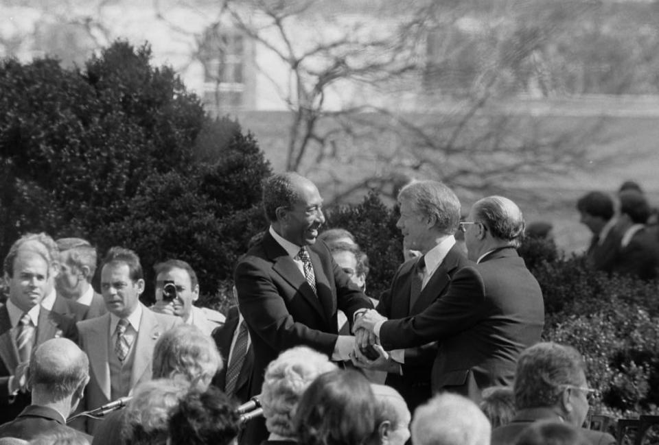 <div class="inline-image__caption"><p>President Jimmy Carter shakes hands with Egyptian President Anwar Sadat and Israeli Prime Minister Menachem Begin at the signing of the Egyptian-Israeli Peace Treaty on the grounds of the White House in 1979.</p></div> <div class="inline-image__credit">Library of Congress</div>