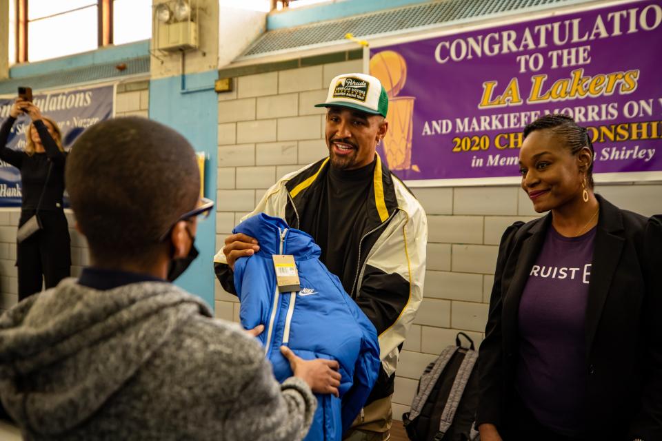 Jalen Hurts passed out 100 coats at the Hank Gathers Youth Access Center, where University of South Carolina women's basketball coach Dawn Staley operates her foundation from.