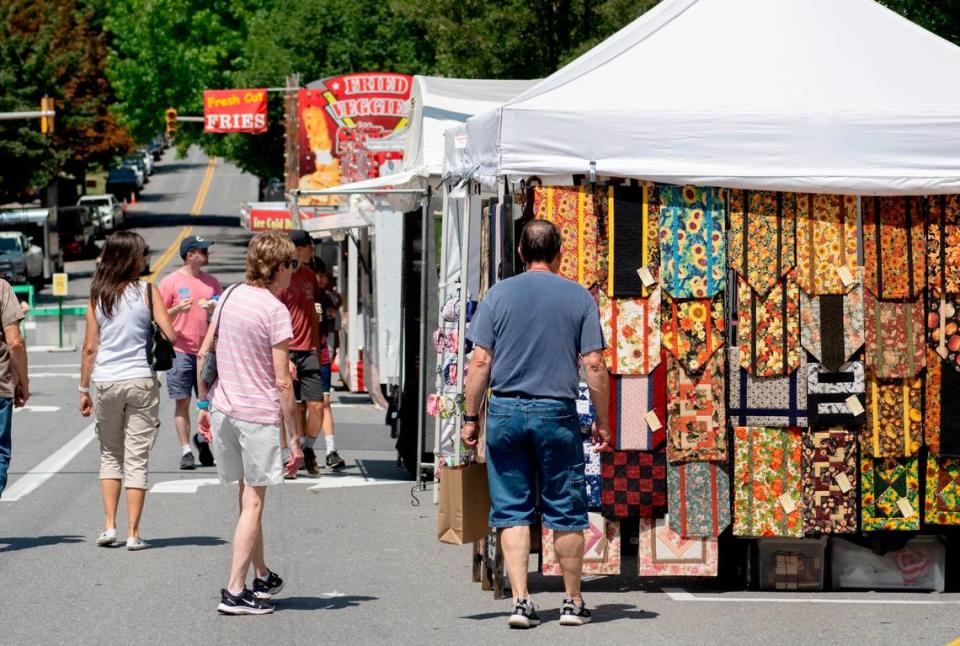 Visitors browse the booths Allegheny Street during the 39th Annual Bellefonte Arts and Crafts Fair on Friday, Aug. 5, 2022. Abby Drey/adrey@centredaily.com