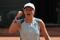 Poland's Iga Swiatek clenches her fist after defeating Jessica Pegula of the U.S. during their quarterfinal match of the French Open tennis tournament at the Roland Garros stadium Wednesday, June 1, 2022 in Paris. Swiatek won 6-3, 6-2. (AP Photo/Thibault Camus)